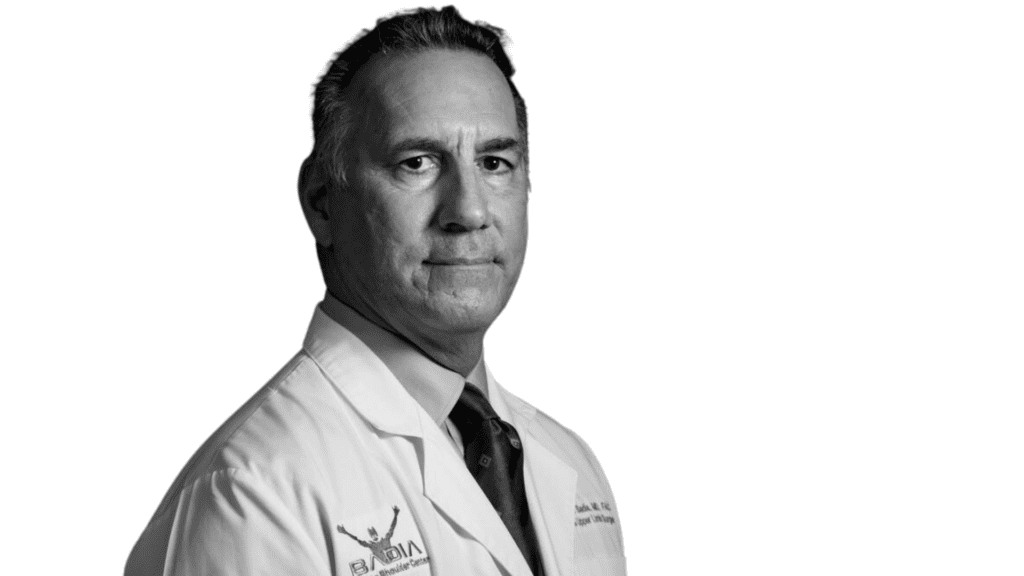 Alejandro Badia orthopedic hand surgeon in white coat, black and white image,