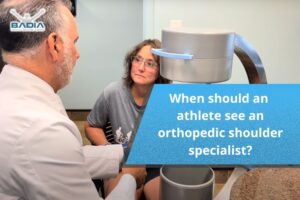When should an athlete see an orthopedic shoulder specialist?